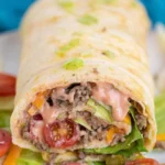 BIG MAC ROLLE mit viel Soße auf einem Teller serviert