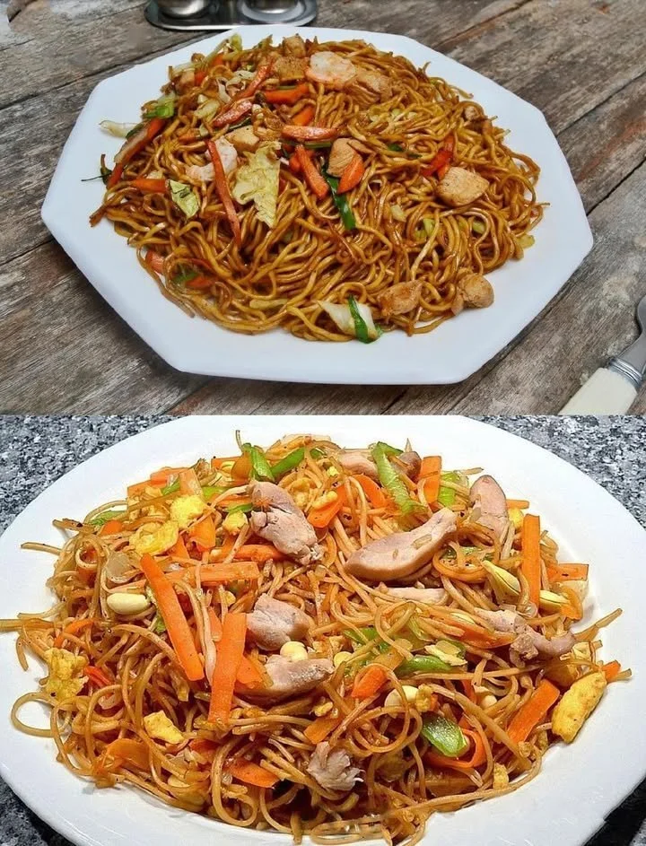 Teller mit gebratenen Nudeln, gemischtem Gemüse und einem Hauch von Sojasauce