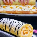 Mandarinen Biskuitrolle auf einem Teller serviert, garniert mit Sahne und Mandarinen.