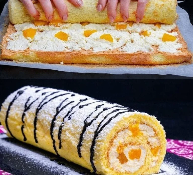 Mandarinen Biskuitrolle auf einem Teller serviert, garniert mit Sahne und Mandarinen.