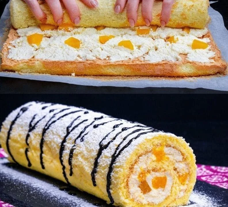 Mandarinen Biskuitrolle auf einem Teller serviert, garniert mit Sahne und Mandarinen.