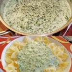Cremige Spinat Frischkäse Soße serviert mit Pasta